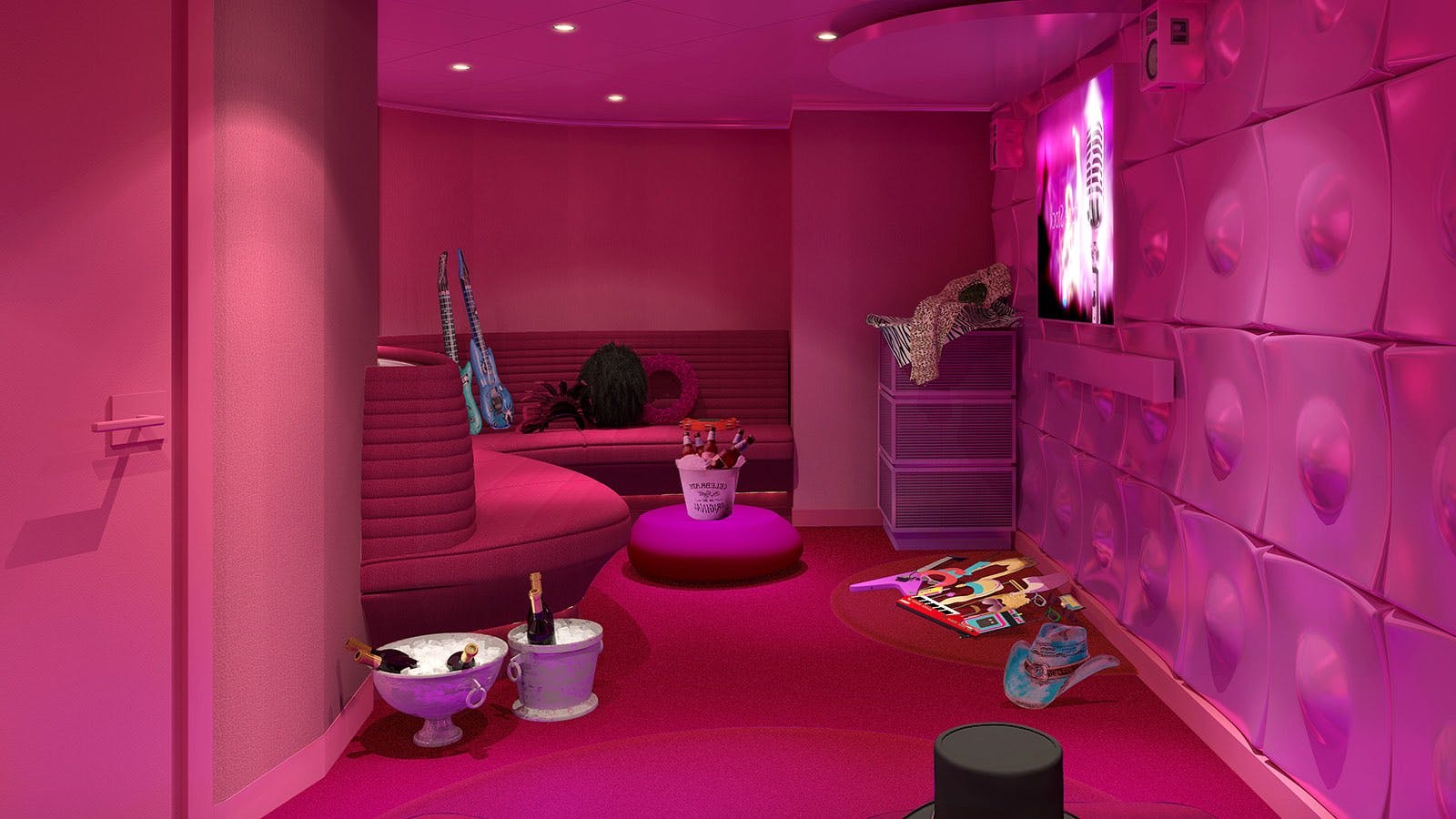 A private karaoke room with pink walls and floor
