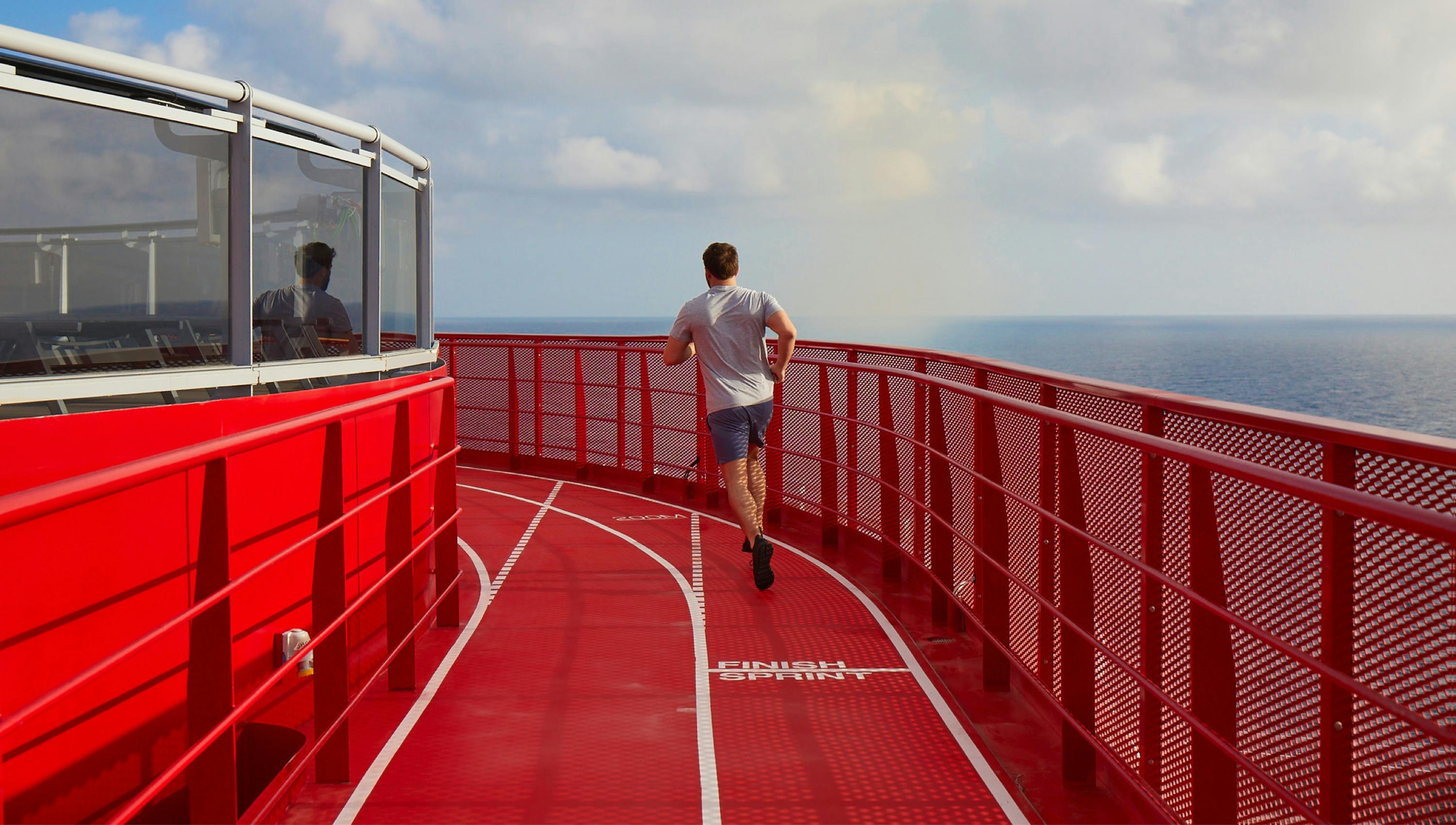 Man running on red track