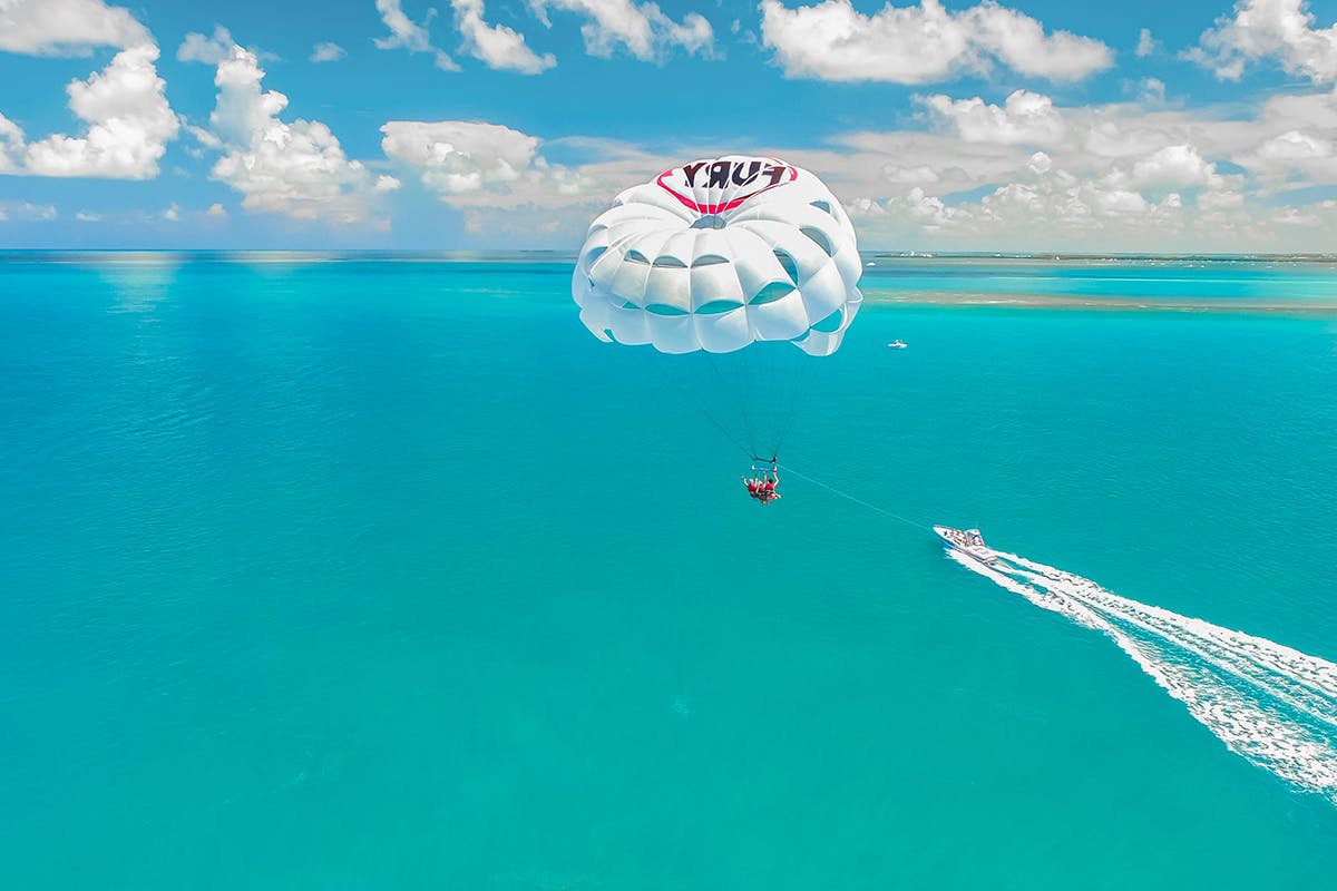 Parasailing and boat riding at turquoise waters